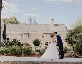 Couple kissing in the garden outside of The Bedford Village Inn