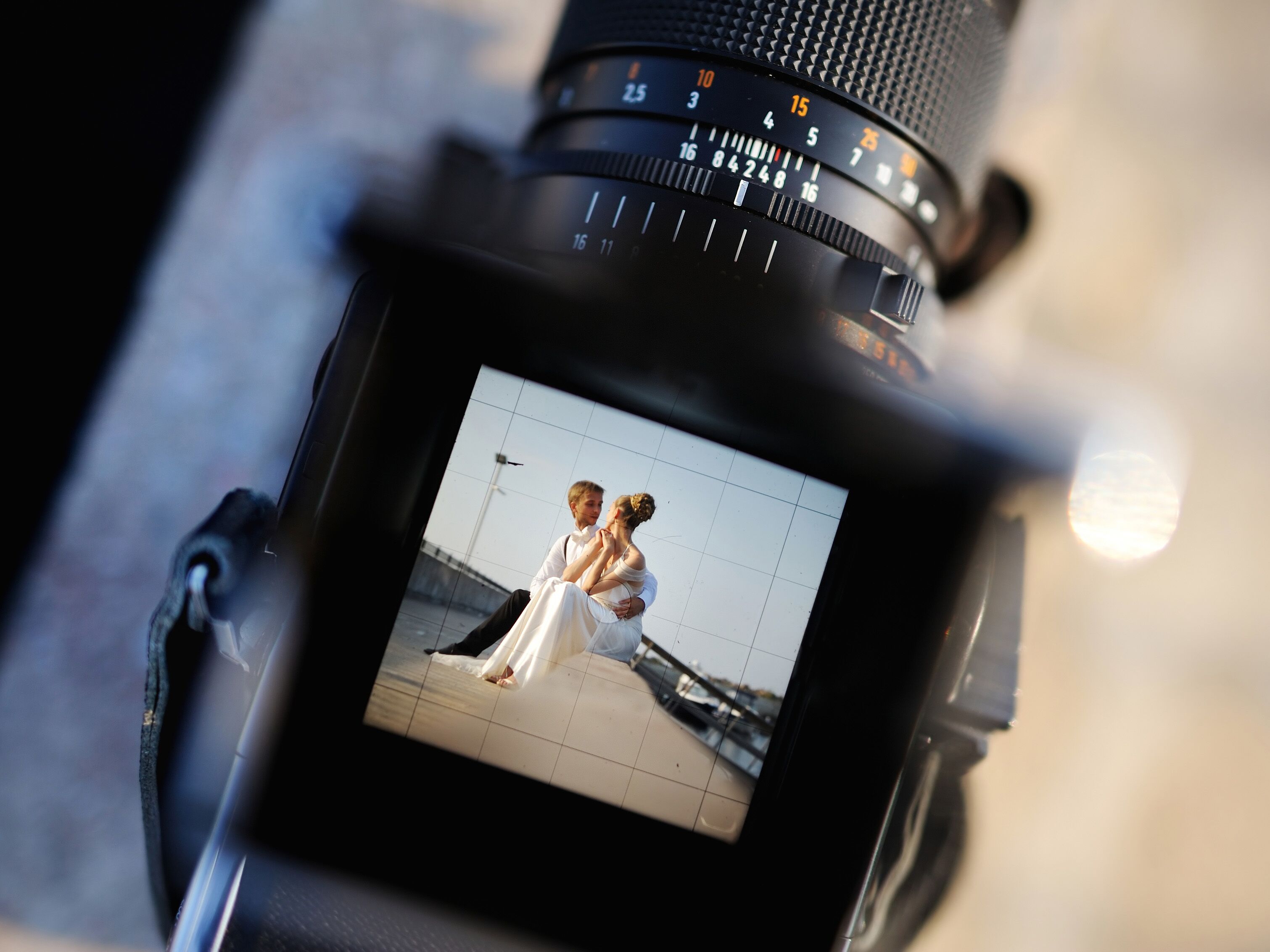 Bride and groom being photographed