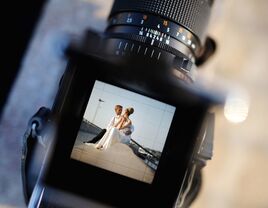 Bride and groom being photographed