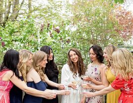 Bride toasting with loved ones.