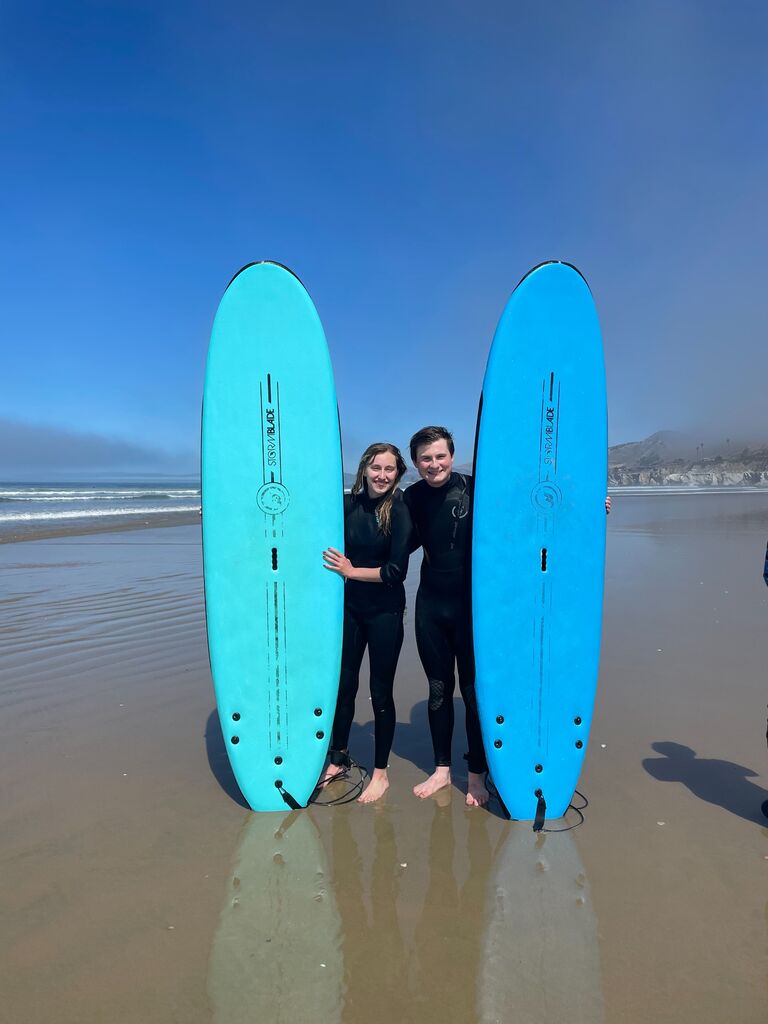 We've stayed active and adventurous through our whole relationship! Our first time surfing together!