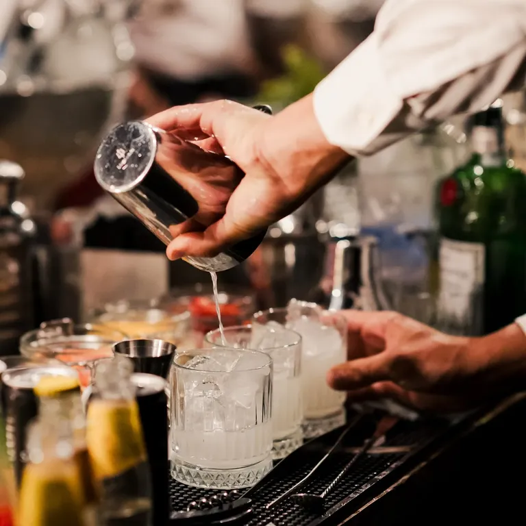 Bartender pouring drinks