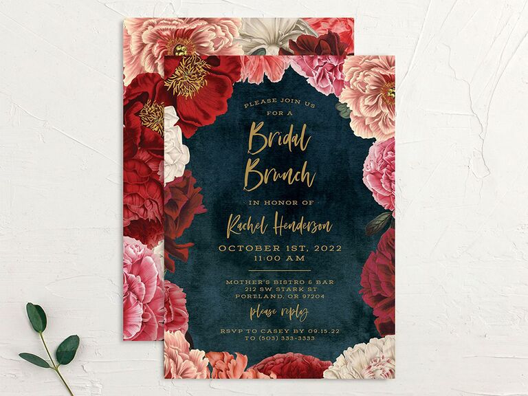 Pink and red flowers surrounding event details in gold type on velvet blue background