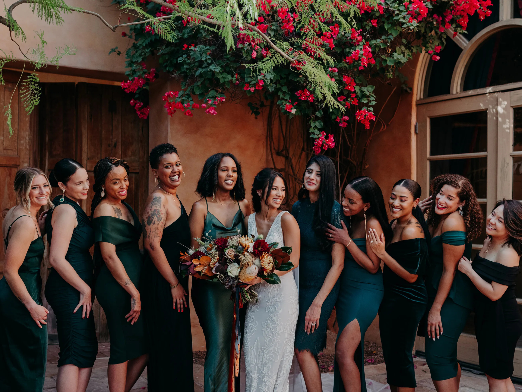 Bridesmaids posing and smiling with bride, what is an honorary bridesmaid