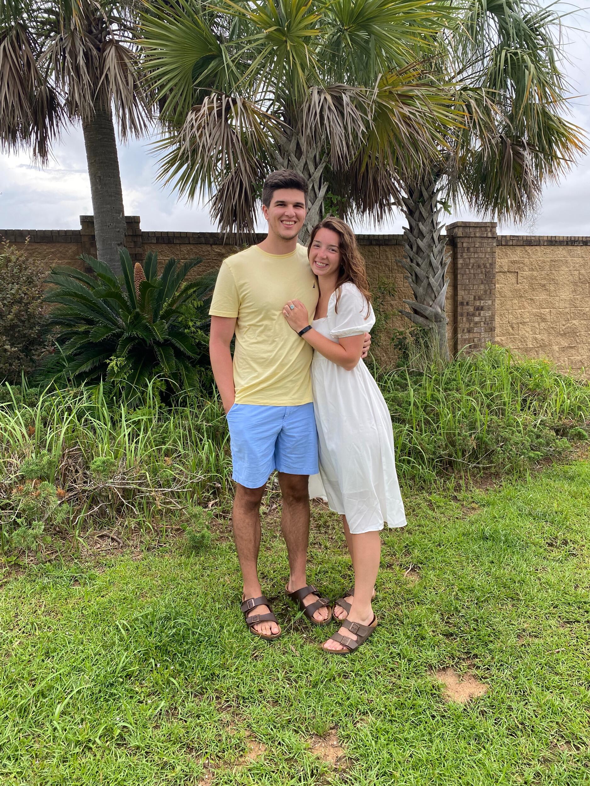 Funny story about this night. While on vacation for the first time with Sydney's family and some family friends, Ben was asked to take pics of Sydney on the pier. As we walked out on it by ourselves, everyone behind us started yelling and jumping up and down saying "He is going to propose!" We just giggled, but Ben may have been a little embarrassed ;)