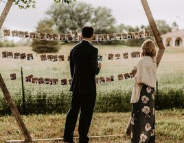 Wedding guests enjoying picture display