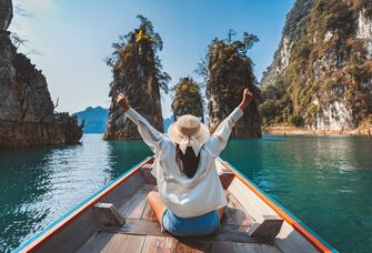 Woman on a boat during her solo trip