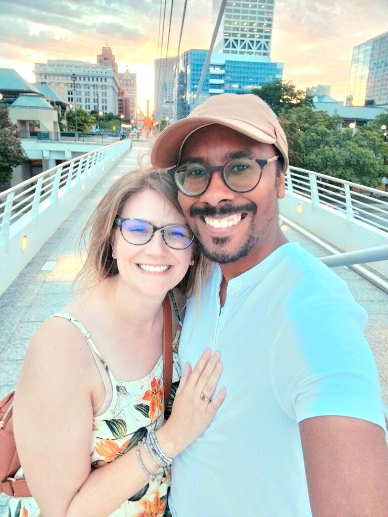 Even though they had already started planning their wedding, Stephen surprised Molly by proposing on the Milwaukee Art Museum bridge at sunset. Molly said "of course!" when Stephen asked to continue their journey together forever!