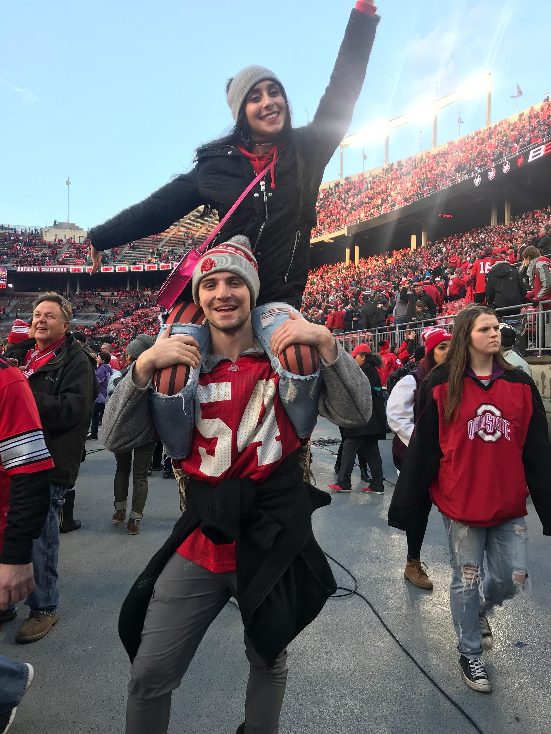 Lila and Tyler storm the field when Ohio State beats *ichigan their senior year!! O-H! 