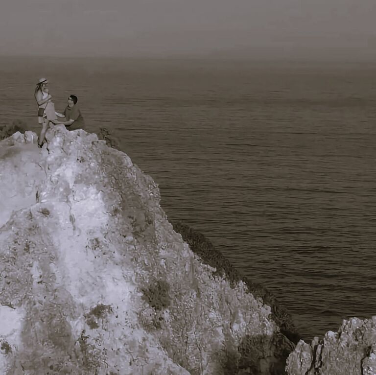 On a Portugal cliffside, and after eight long years together, Keegan finally asked Morgan to marry him. She of course said yes!