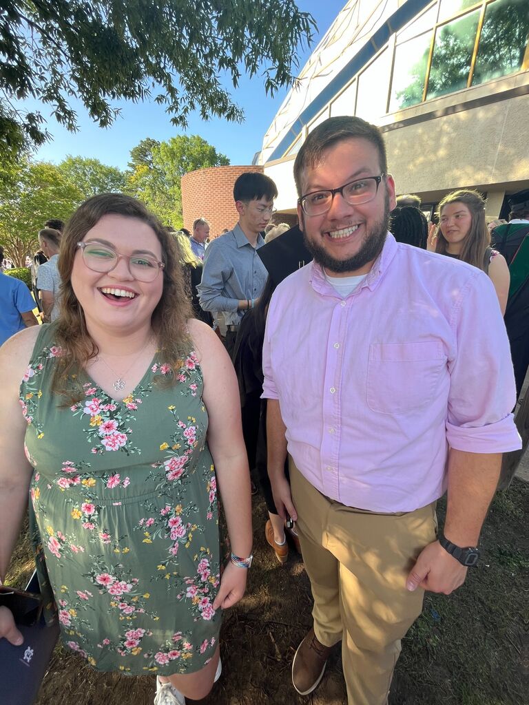 The first picture of the two of us! A sneaky friend noticed our matching colors and took a photo. This was around the time we each started to have an interest in the other.