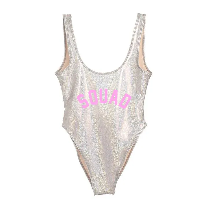 silver metallic one piece with 'squad' in pink type