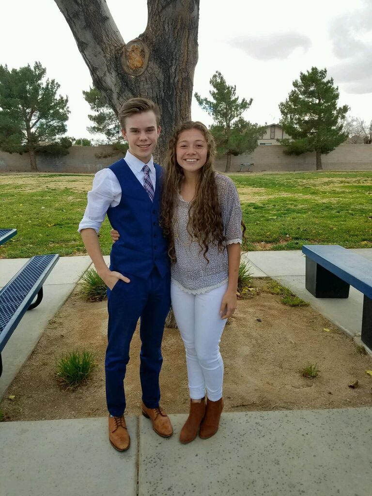 Sophomore year, with Caleb and Sofia both in game-day dress for our sports.