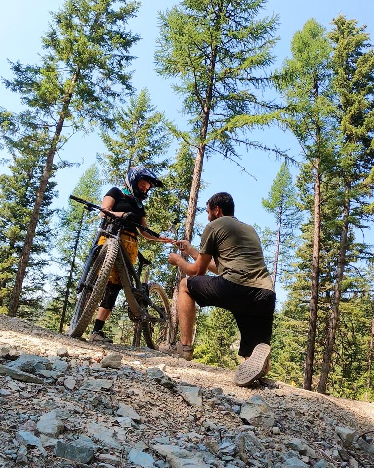 Colten  proposed while downhill biking at Whitefish Mountain Resort. He told Iris he was going ahead to capture video of her hitting a jump, but he was down on one knee instead! And of course, she said yes.