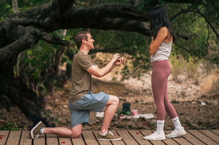 Justin took Vivian on a 6 am hike in Santee, CA and proposed to her on a bridge with the help of her brother Vincent and her cousin Trang!
