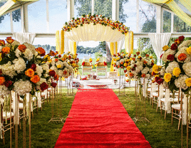 Red aisle runner at a Hindu wedding ceremony. 