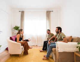 Couple speaking with premarital counselor in San Diego, California