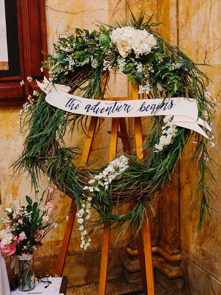 Flower and greenery wreath for a rustic wedding entrance