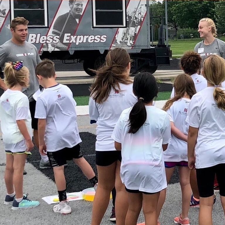 This is technically their first photo together when they were paired together to run a station at a UIndy Summer Camp... the way she is already looking at him 👀