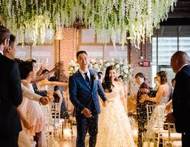 bride and groom recessional with gold confetti