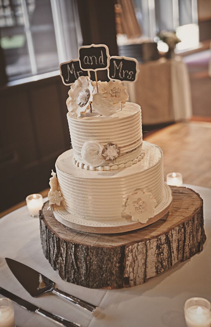 Two Tier White Wedding Cake With Chalkboard Cake Topper On Wood