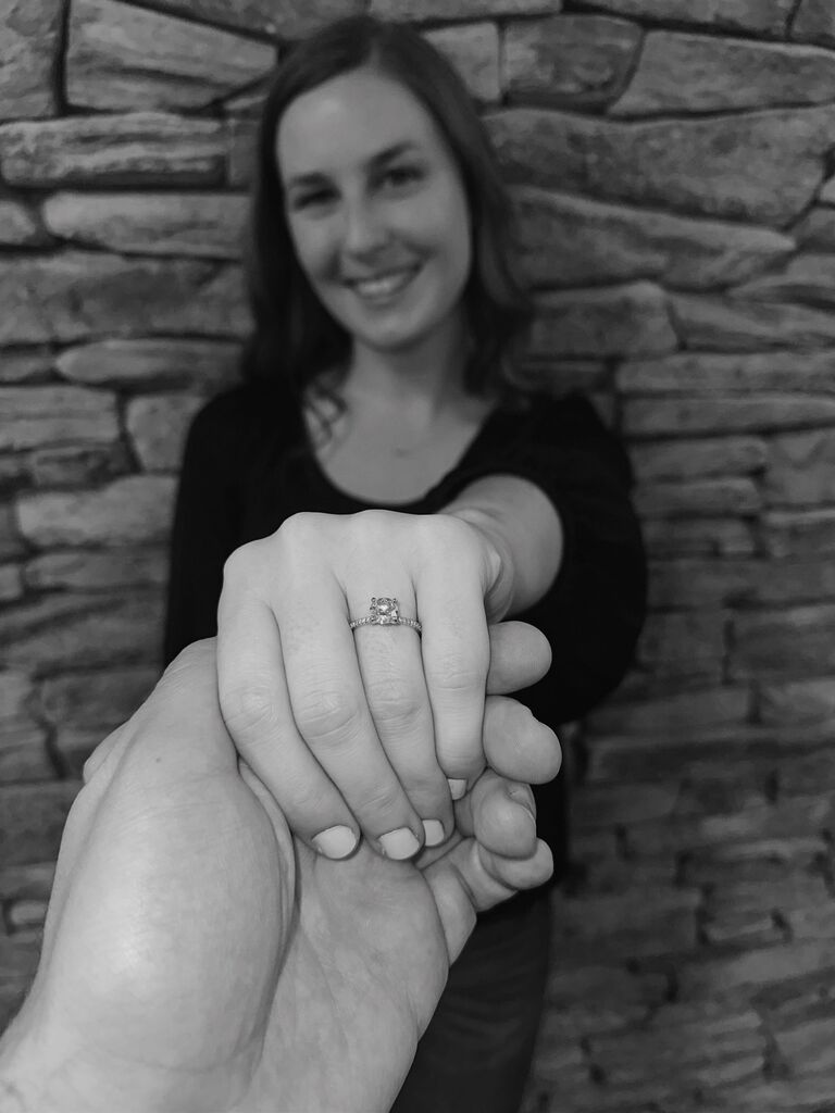 The proposal!

Haley was visiting her college roommates for the weekend and told Garrett she wouldn't be able to visit that weekend. Sunday morning came around and Haley decided to surprise Garrett with a visit. After spending the day vacuuming out their cars and building Garrett's new grill, Garrett decided they should go for a walk. After a few complaints from Haley (it was super windy out!) they decided to go. Little did Haley know, Garrett had a ring hidden in his pocket. Garrett proposed in a park near their house!