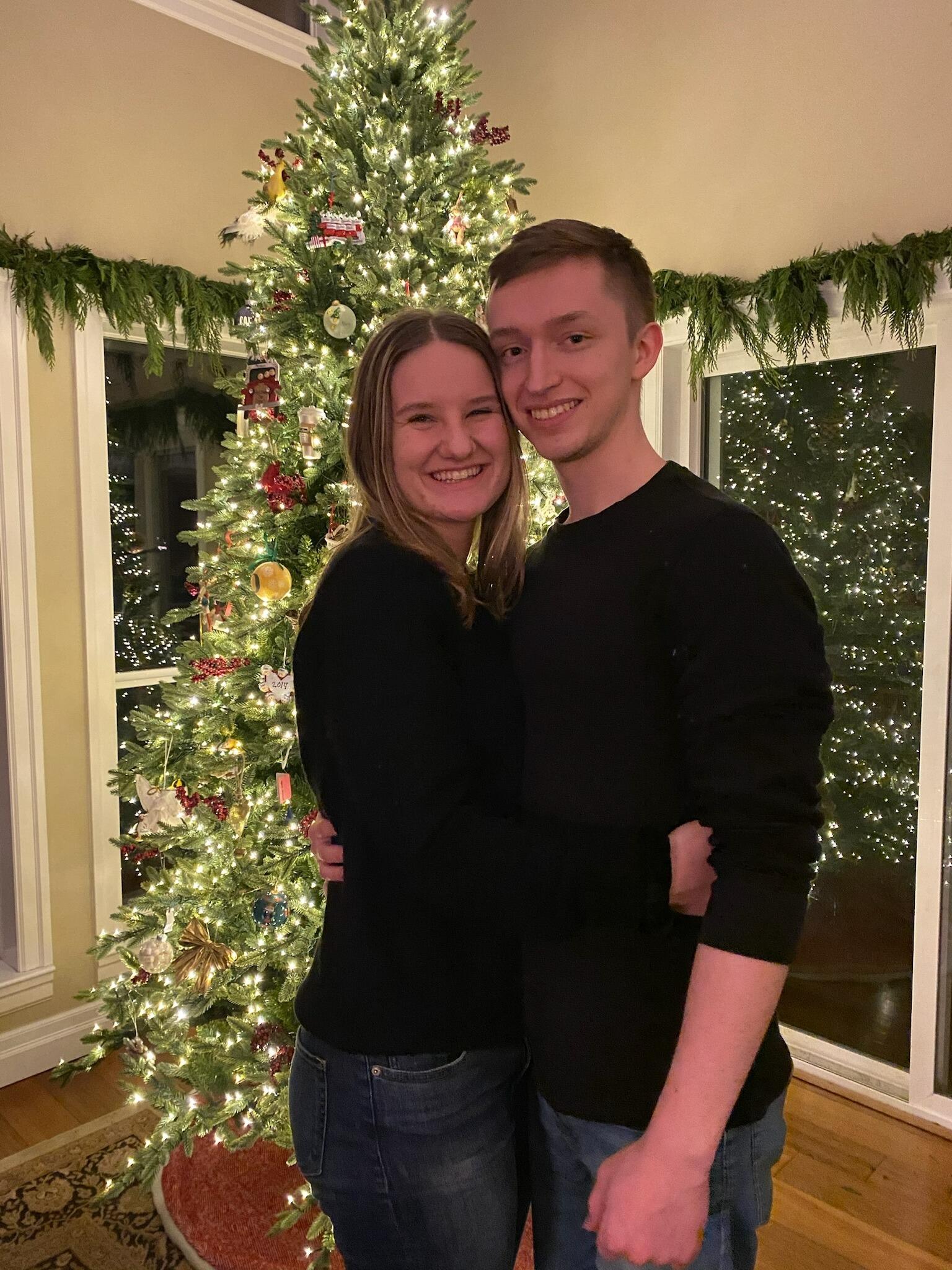 Our first holiday season together as boyfriend and girlfriend was wonderful. We spent as many days together as possible, decorating the house, baking cookies, and enjoying cozy nights by the fire. Here's a photo of us by the Mac Christmas tree!