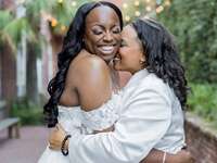 two brides snuggling and laughing