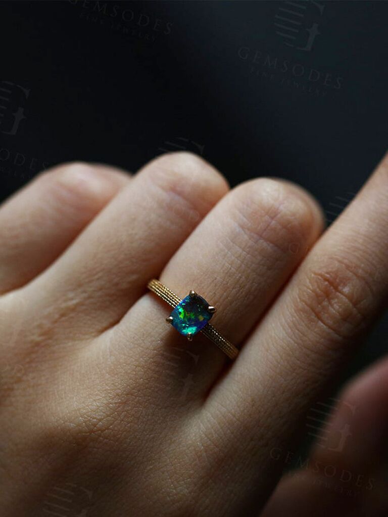 Black opal engagement ring on milgrain band