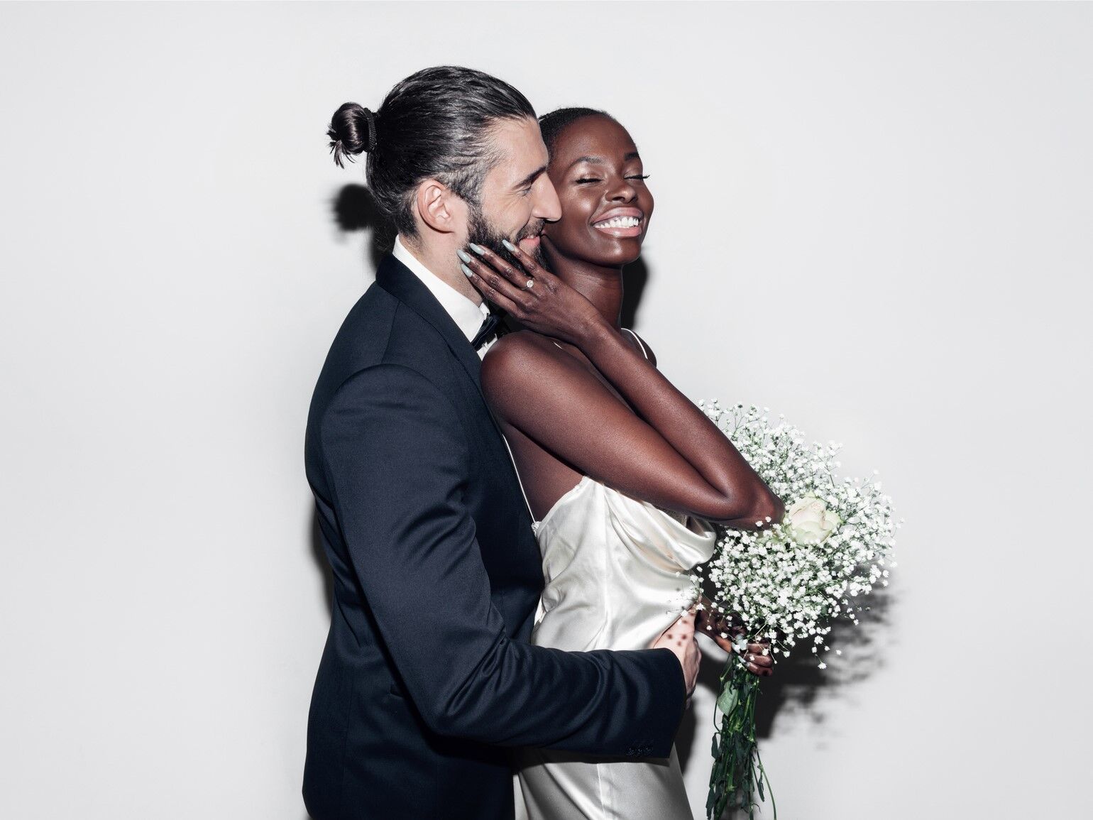 Happy wedding couple posing for a portrait