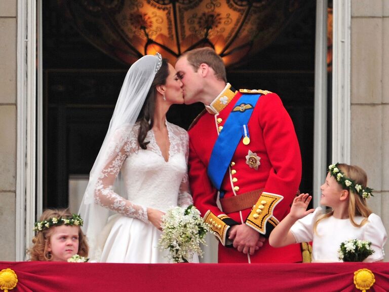 Prince William and Kate Middleton kissing on the royal balcony on their wedding day
