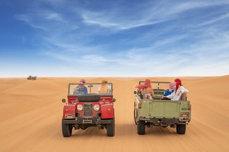 honeymoon outing in the middle east desert in throwback range rovers