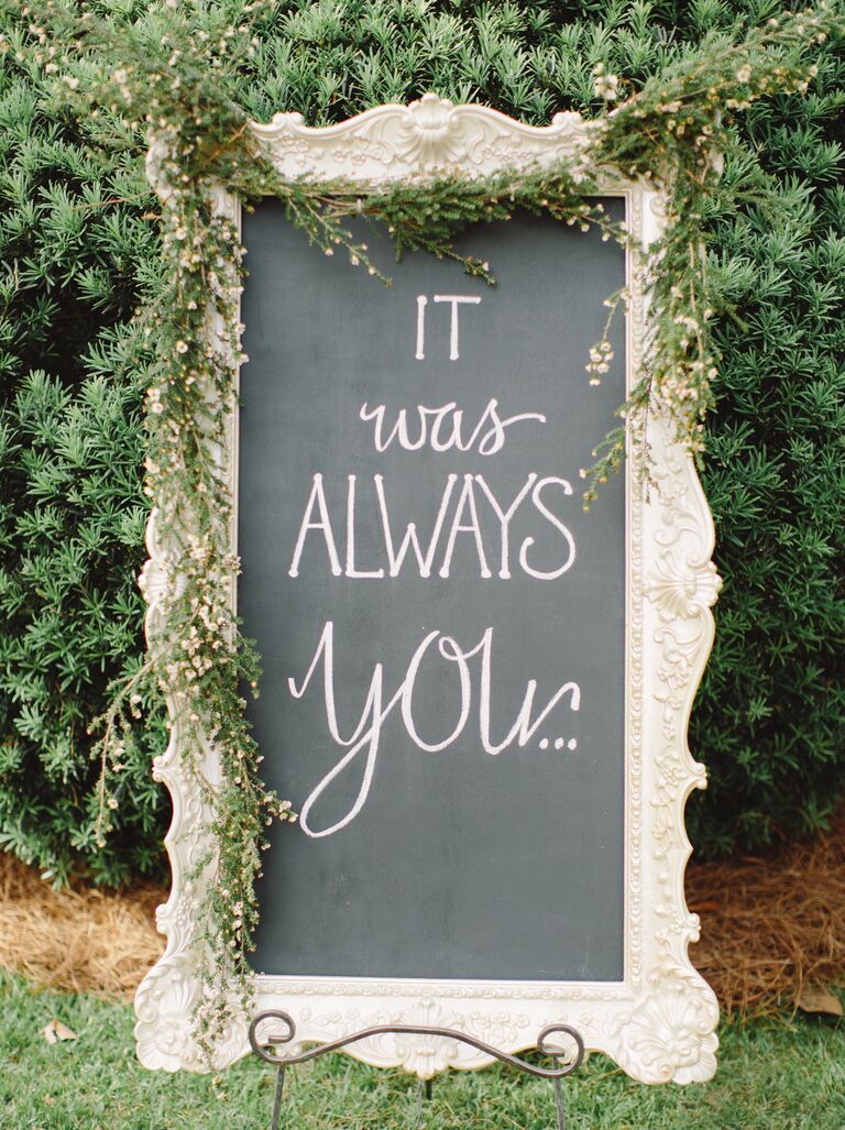 Elegant chalkboard sign displaying romantic quote 