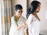 Mother of bride helping daughter get ready