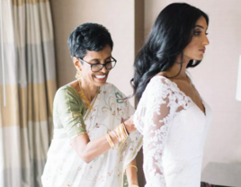 Mother of bride helping daughter get ready