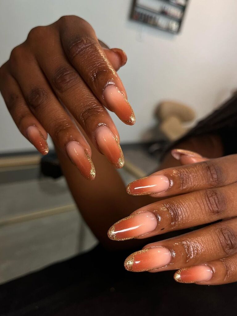 Burnt orange ombre bridesmaid nails with gold glitter tips
