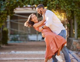 Couple having a fun time dancing outside