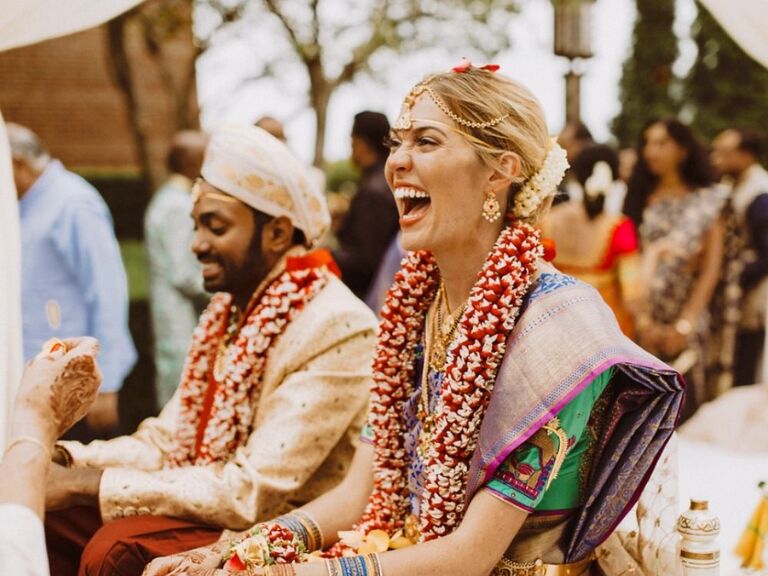 couple smiling during Indian wedding ceremony