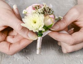 Florist showing how to DIY a boutonniere