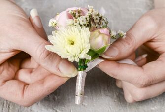 Florist showing how to DIY a boutonniere