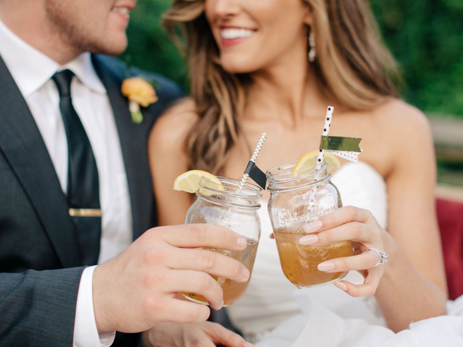 Bride and groom with signature cocktails