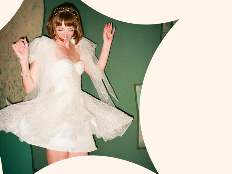 Women dancing in mini wedding dress