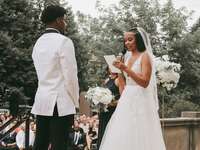 Couple exchanging vows during wedding ceremony.