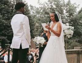 Couple exchanging vows during wedding ceremony.