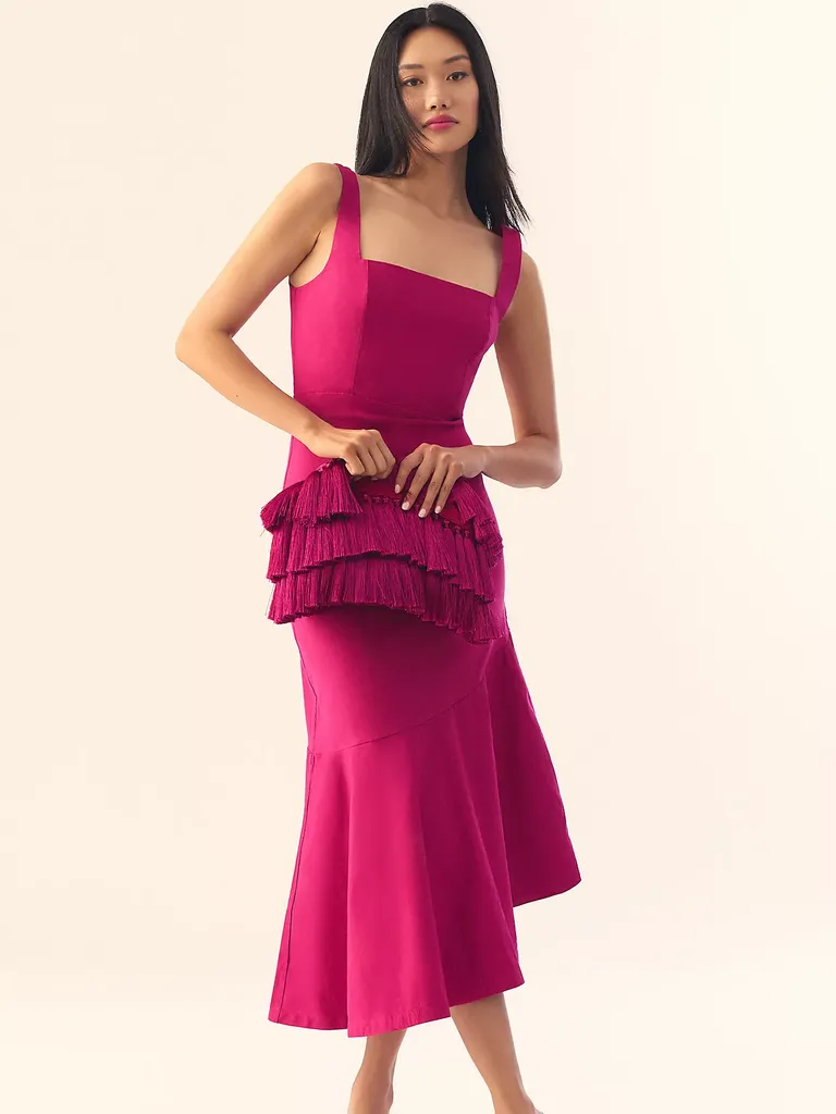 Woman in pink evening gown and matching handbag