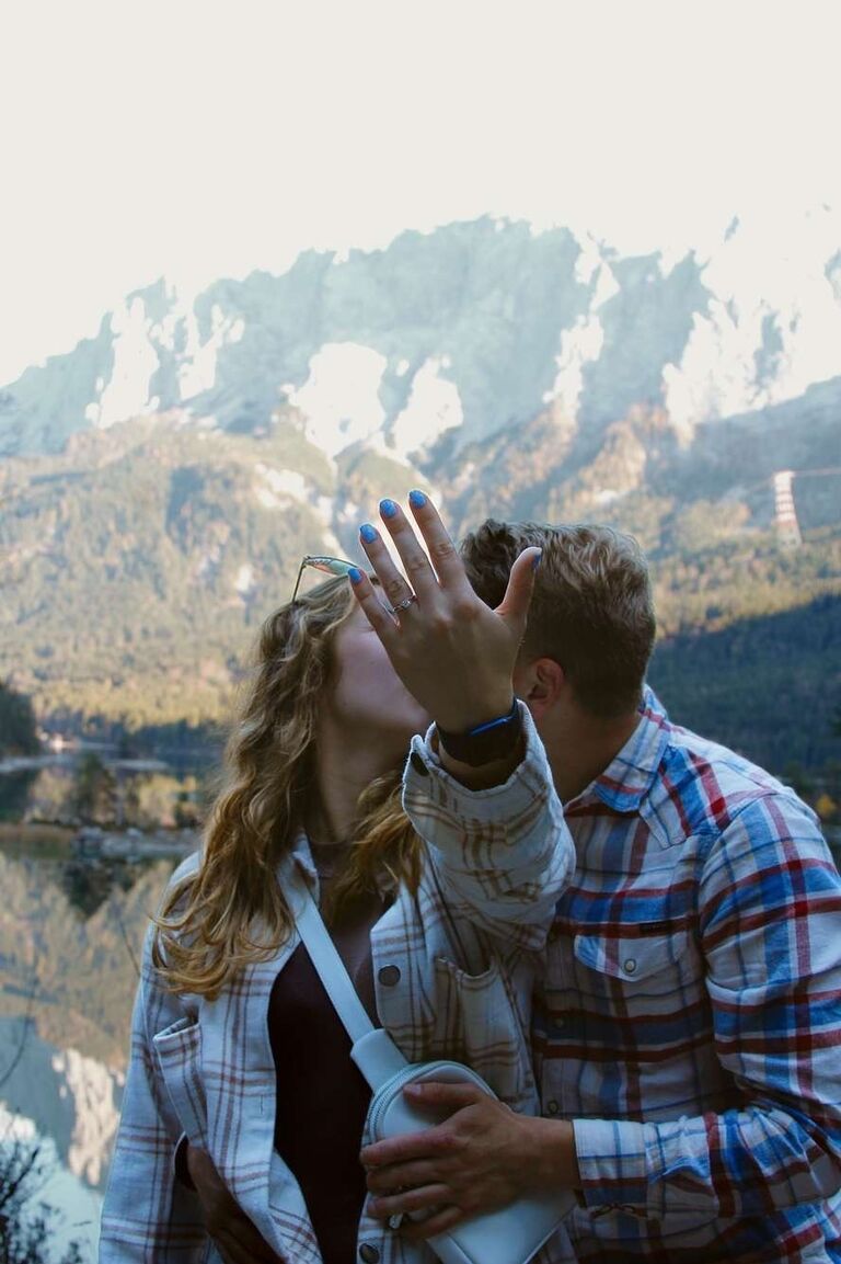 Caitlin and Brandon were invited to see the elopement of Caitlin's best friend in Switzerland and travel with them and their families from Switzerland to Germany. 

It was towards the end of the trip in Germany at Lake Eibsee where Brandon proposed to Caitlin on October 27, 2022. 