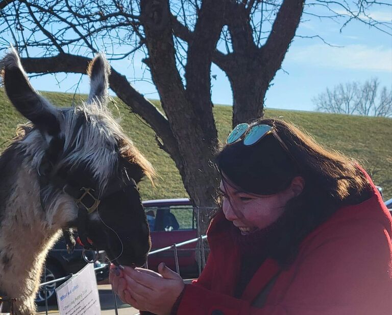 This picture was the first one of me taken by Adam. We were exploring a Christmas festival in Galena, Illinois, and there was a petting zoo. I got to feed the llamas. I was very happy. :P