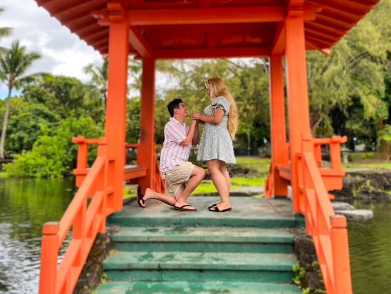 Engagement! On the Big Island in HI, amidst the breathtaking beauty of Liliuokalani Gardens, a moment of pure magic unfolded. It was there, on a picturesque bridge encircled by tranquil waters that time stood still. Justin proposed with the most stunning ring, one he had designed with my designer. The proposal was all the more special in the presence of our best friends Morgan & Carter. 