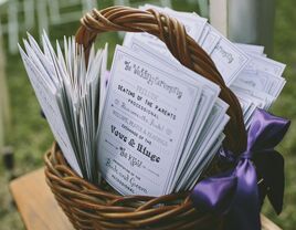 Wedding ceremony programs in a basket