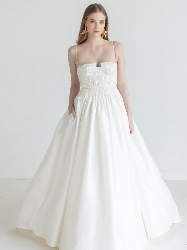 White wedding dress with a full skirt for a beach wedding. 